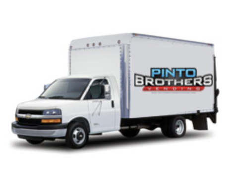 Woman with water bottle at vending machine